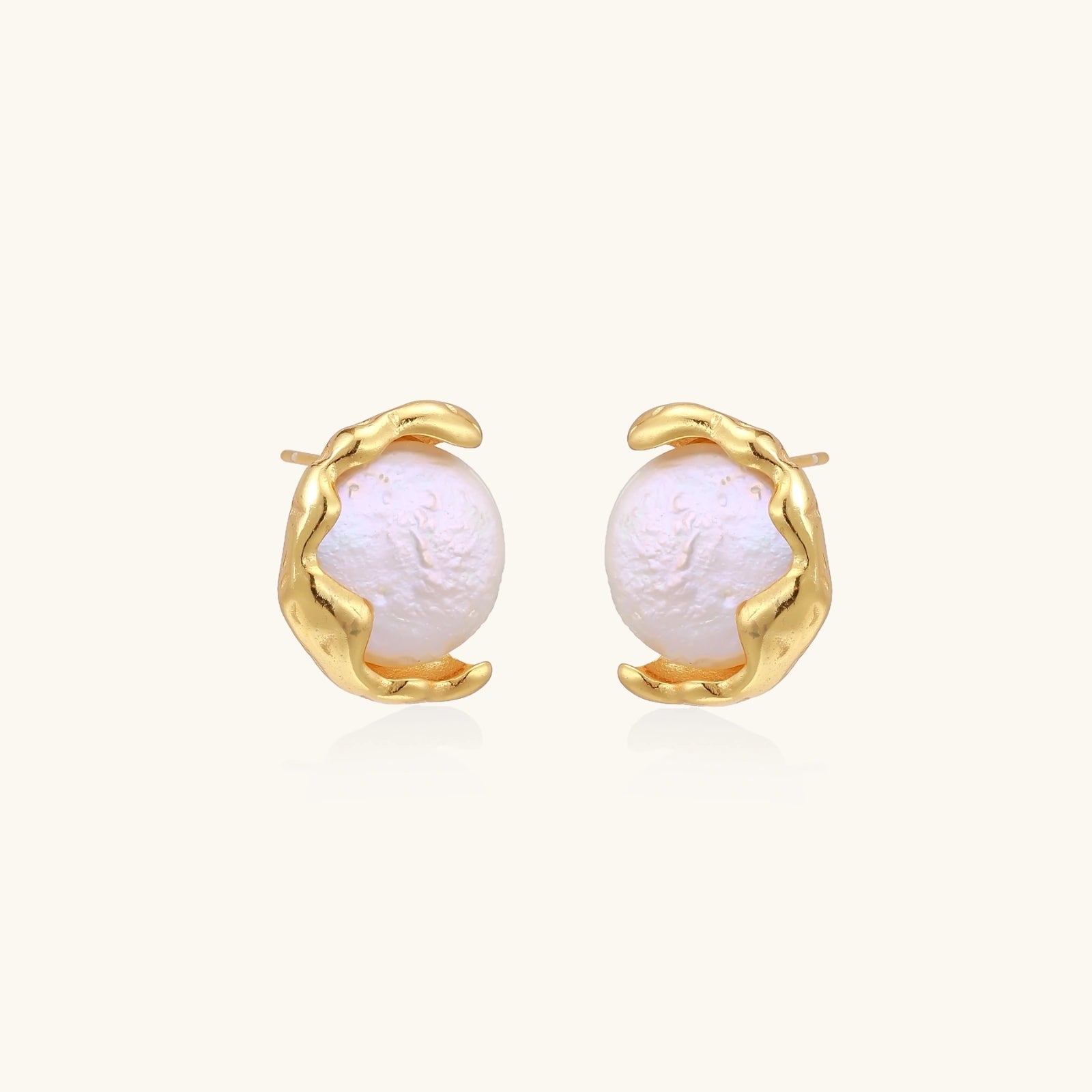 Gold vermeil studs with lustrous pink freshwater pearls in organic crescent settings